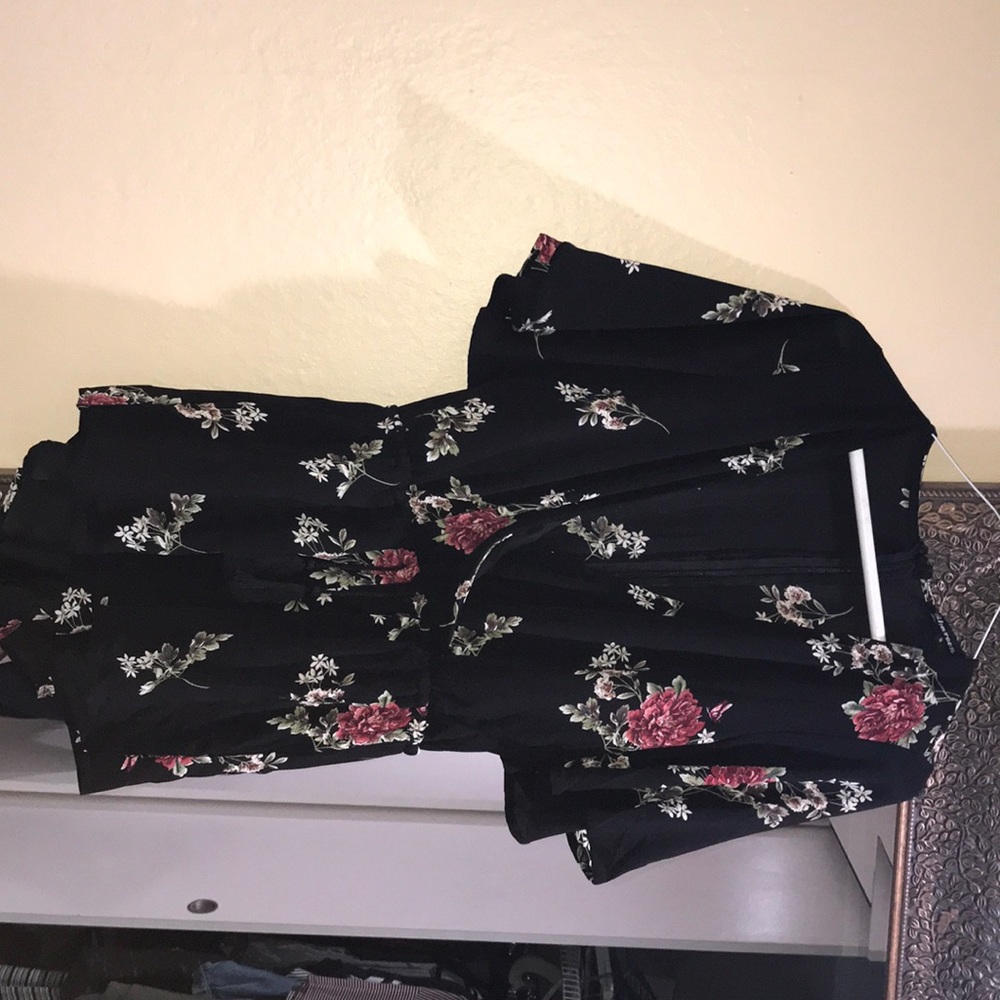 A black floral romper from Mura Boutique